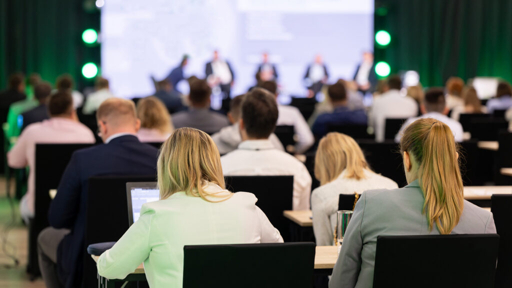 Rear view of a Safety Conference with guest speaker in the background blurred
