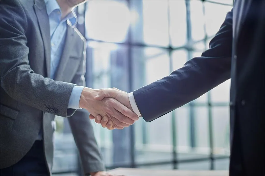 Two business men shaking hands