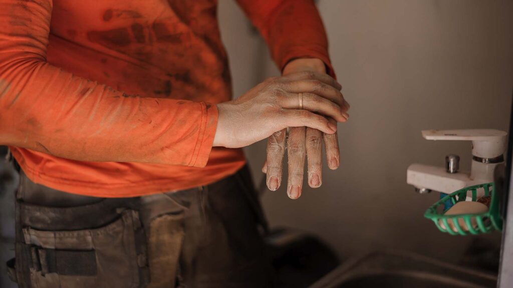Close up of a worker walking hands