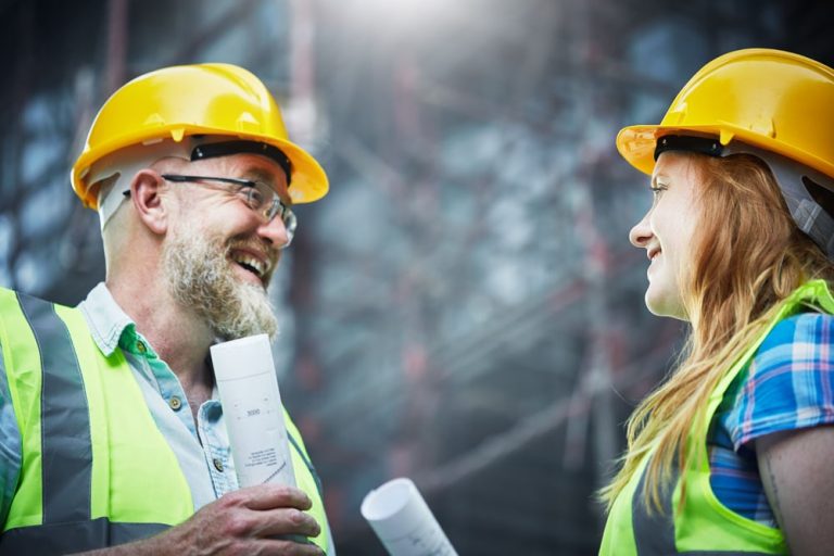 Two employees talking amongst each other