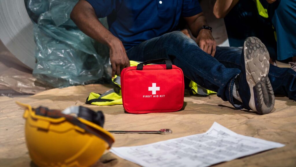 close up of a first aid kit near injured man