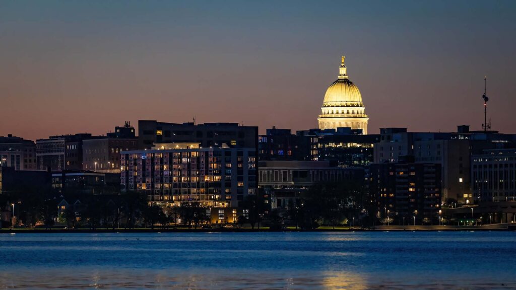 Wide shot view at night of Wisconsin State Capital reflect on Lake Mendota